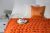 Плед крупной вязки из толстой пряжи мериноса оранжевый 110х110 см
